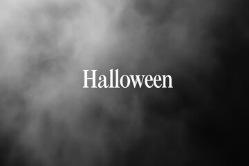 A simple Halloween text becomes the focal point amidst a smoky, eerie background in October