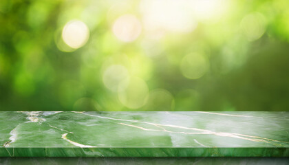 Green marble tabletop with a defocused green foliage background, ideal for displaying products or showcasing natural and minimalist designs.