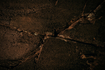 Dark cracked stone