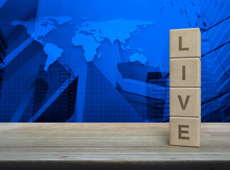 Live letter on wood block cubes on wooden table over world map, modern office city tower and skyscraper, Technology broadcasting communication concept, Elements of this image furnished by NASA