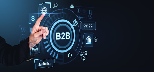 Hand interacting with digital B2B interface icons on dark background.