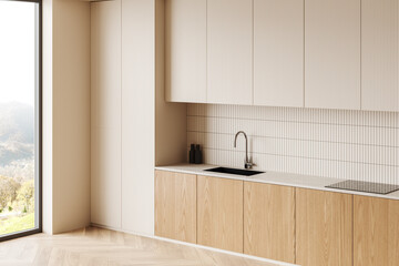 Beige and wooden home kitchen interior with cooking cabinet, panoramic window