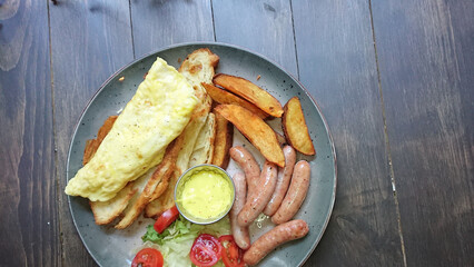 Grilled Sausages with Potato Wedges on Plate
