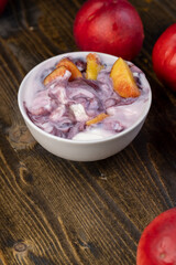 natural yogurt in a white bowl with fruits