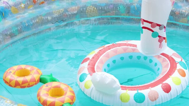 Inflatable pool in summer with swimming lap. Children and water games. Summer fun. 