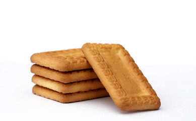 Indian biscuits stacked over white background