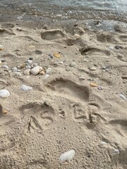 aesthetic couple initials on the beach sand, AS + ER