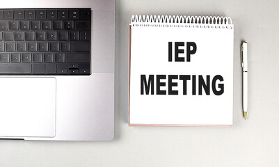 IEP MEETING text on notebook with laptop, mouse and pen