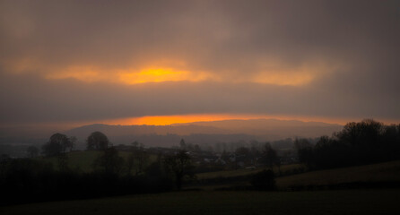 Fototapeta premium Misty morning sunrise over Gwernaffield, Mold, Wales