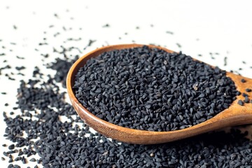 Black Cumin or Kalonji Heap in a Wooden Spoon Isolated on White Background with Copy Space, Also Known as Black Caraway, Nigella Sativa or Charnushka