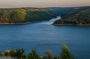 Landscape of Bakota River and mountains Ukraine Dniester River. Photo of the flooded village.   .   .