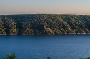 Landscape of Bakota River and mountains Ukraine Dniester River. Photo of the flooded village.   .   .
