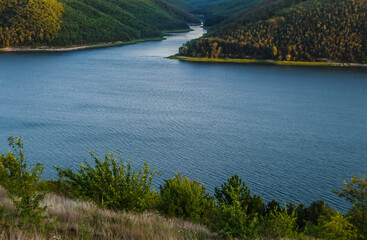 Landscape of Bakota River and mountains Ukraine Dniester River. Photo of the flooded village.   .   .