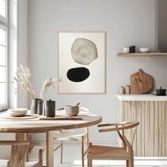 A black and white abstract painting is hanging on the wall above a wooden kitchen island. The painting features a circle and a square, with the circle being larger than the square