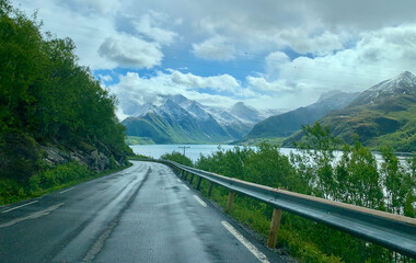 Scenic road trip in rain through rugged landscape in Norway