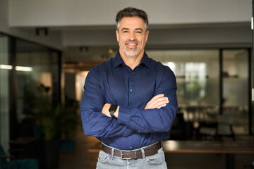 Portrait of happy mature 50 year old professional business owner man manager, smiling senior male...