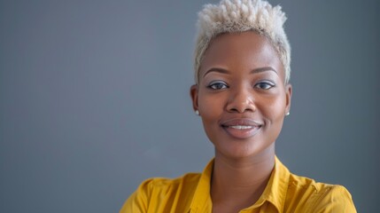 Black woman with beauty, glow, or cosmetics regimen in studio. Young African girl model with face cosmetology at gray background is happy and joyful.