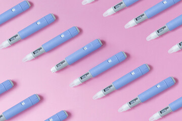 medical drug Ozempic injection lies on a pink background, top view. Medicine and weight loss,...