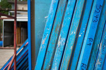 Silk screen printing screens stored in a outdoors in a metal rack ready for printing. Replacing and...