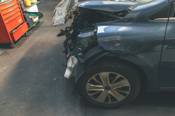 Top view of the front part of the car after an accident in a car repair service. Copy space