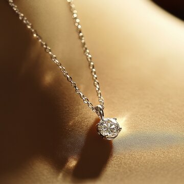 Solitaire Elegance: A timeless and elegant solitaire diamond pendant necklace, featuring a sparkling round brilliant diamond set in a delicate silver chain. 