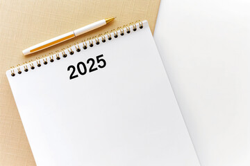 A calendar with a pen placed on top, ready for scheduling and planning.