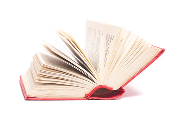 Open red cover book isolated on white.