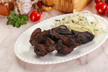 Grilled beef barbecue served onion