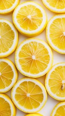 Fototapeta premium Design a refreshing background with a top view of real lemon slices, captured in high definition with a clean, noise-free presentation that emphasizes the vibrant yellow color and zesty texture 