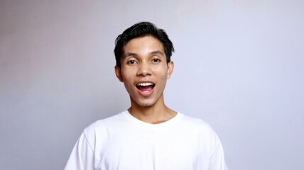 close up handsome young asian man wearing white shirt happy expression