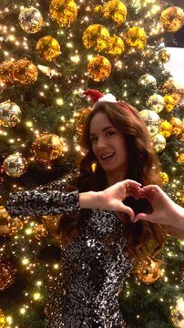 Girl Near Christmas Tree With Bokal of Shampain