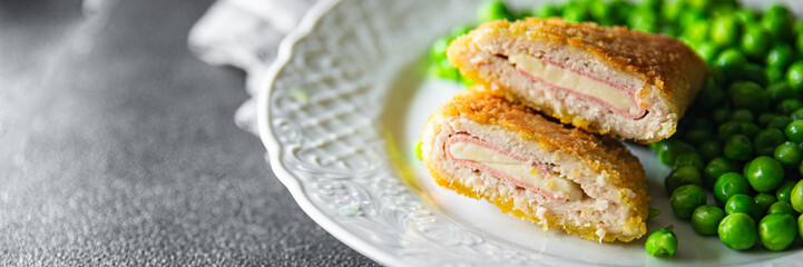 cutlet cordon bleu chicken meat, cheese, bacon meal snack on the table copy space food background rustic top view