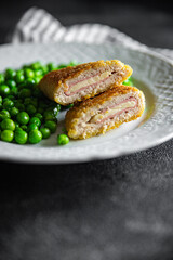 cutlet cordon bleu chicken meat, cheese, bacon meal snack on the table copy space food background rustic top view