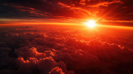Vivid Red Sunset with Sun Rays and Clouds Viewed from Space