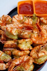Fried prawn or fried shrimps sauteed with salt and pepper and garlic served in plate, good for cooking book ora recipes or multimedia cooking content