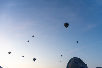 Hot air balloon takeoff to watch the sun rise at dawn