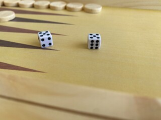 Backgammon game. Wooden board with backgammon game pieces with dice