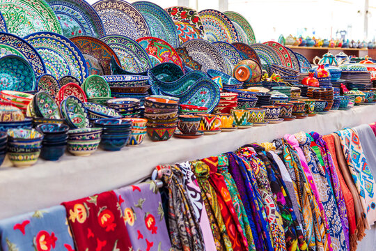 Multicolored ceramic dishes with oriental ornaments at the Siab Bazaar.