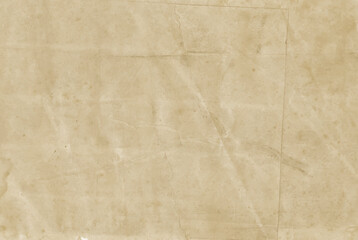 Old wrinkled stained paper background. Vintage ragged crumpled sheet or parchment