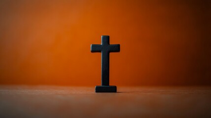 Black Holy Cross on Minimalist Orange Halloween Background