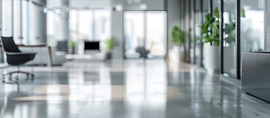 An empty contemporary office interior with blurred background showing furniture and computers ideal for adding text or graphics in the copy space image