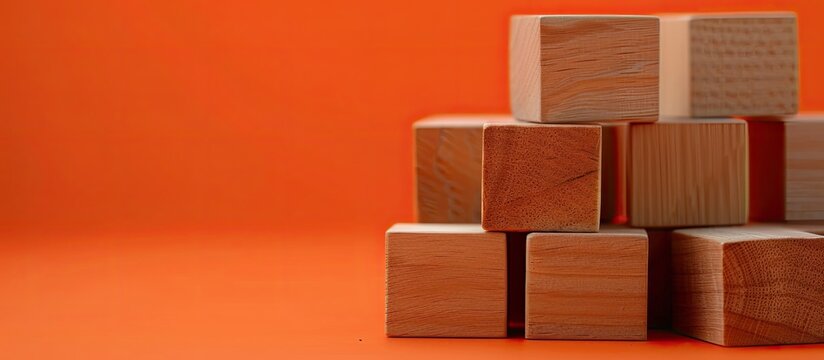 Wooden blocks with a business core values message against an orange background serve as a symbolic representation of essential business principles Includes copy space image