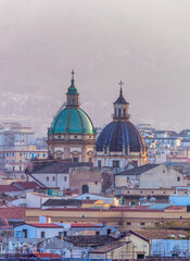 Fototapeta premium Residential Homes and Historic Church Buildings with mountains. Palermo, Sicily, Italy