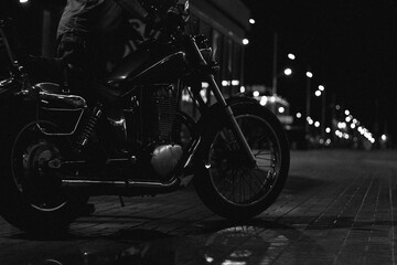 red chopper motorcycle at night. bike in the rain