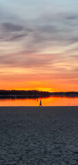 beautiful sunset in orange intensive colors in hietaniemi beach in helsinki finland