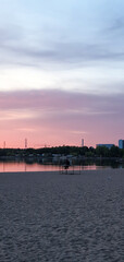 Naklejka premium beautiful sunset in orange intensive colors in hietaniemi beach in helsinki finland