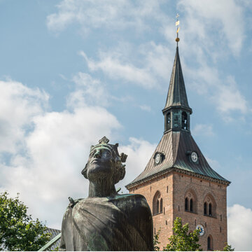 bronze monument of Saint Canute in front of the Odense Cathedral