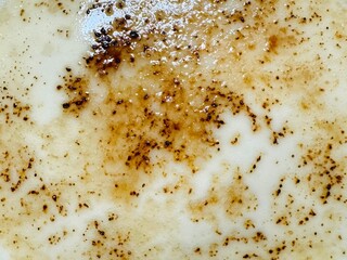 Foamed milk cream topped with coffee flakes