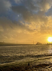 Sunset over Lisbon's 25 de Abril Bridge