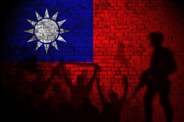 taiwan flag painting on brick wall and Protesters shadow